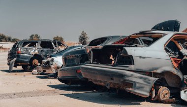 damaged and looted cars in a city in Ukraine during the war with Russia