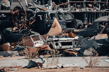 damaged and looted cars in a city in Ukraine during the war with Russia