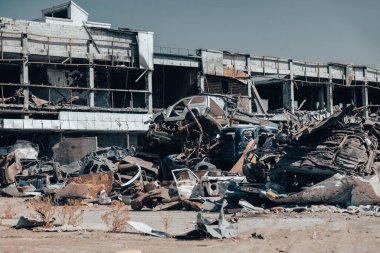 damaged and looted cars in a city in Ukraine during the war with Russia