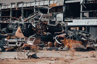 damaged and looted cars in a city in Ukraine during the war with Russia