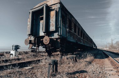end of the road damaged and burnt trains war in Ukraine with Russia