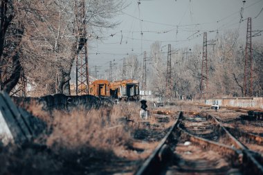 end of the road damaged and burnt trains war in Ukraine with Russia