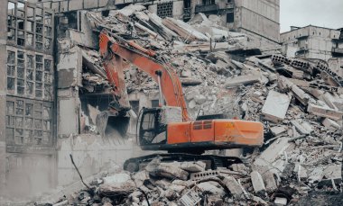 construction equipment destroys affected houses war in Ukraine with Russia