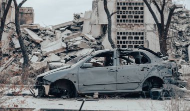 damaged and looted cars in a city in Ukraine during the war with Russia