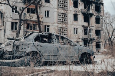 damaged and looted cars in a city in Ukraine during the war with Russia