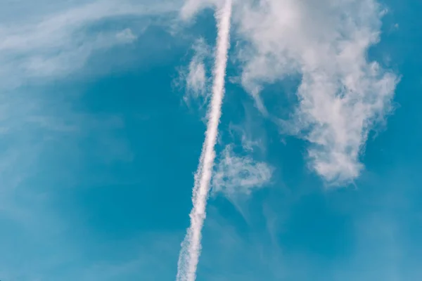 stock image contrail of a rocket launch in the blue sky war in Ukraine