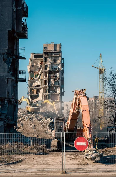 construction equipment destroys affected houses war in Ukraine with Russia