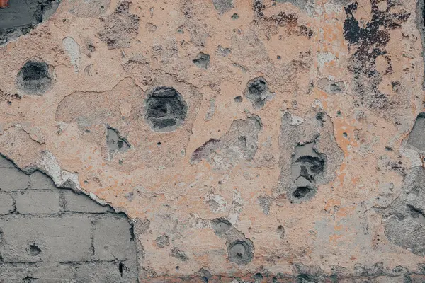 pattern explosion-damaged wall of the house of the war in Ukraine