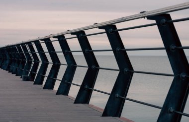 empty pier by the sea without people in autumn
