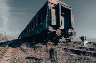 end of the road damaged and burnt trains war in Ukraine with Russia