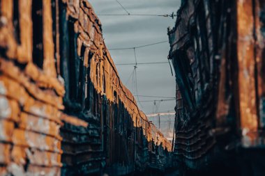 end of the road damaged and burnt trains war in Ukraine with Russia