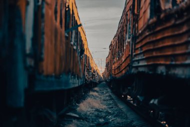 end of the road damaged and burnt trains war in Ukraine with Russia