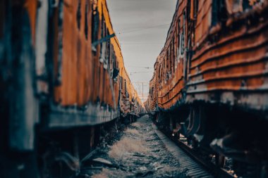 end of the road damaged and burnt trains war in Ukraine with Russia