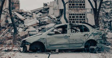 damaged and looted cars in a city in Ukraine during the war with Russia