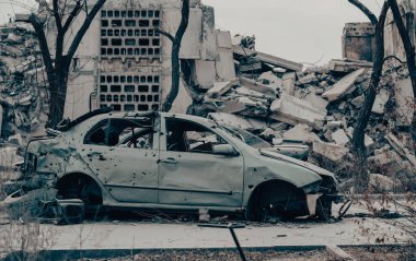 damaged and looted cars in a city in Ukraine during the war with Russia