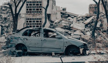 damaged and looted cars in a city in Ukraine during the war with Russia
