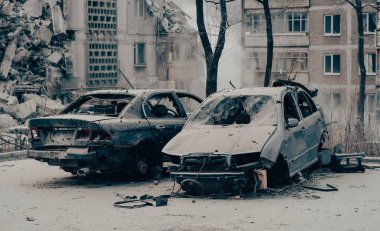 damaged and looted cars in a city in Ukraine during the war with Russia