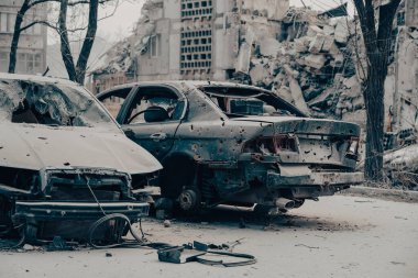 damaged and looted cars in a city in Ukraine during the war with Russia