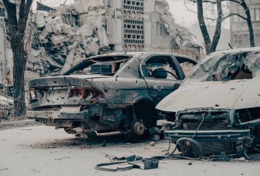 damaged and looted cars in a city in Ukraine during the war with Russia