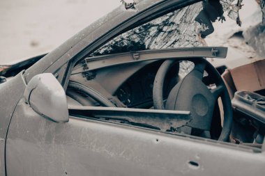 damaged and looted cars in a city in Ukraine during the war with Russia