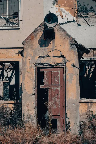 old broken wooden door of a destroyed house war in Ukraine