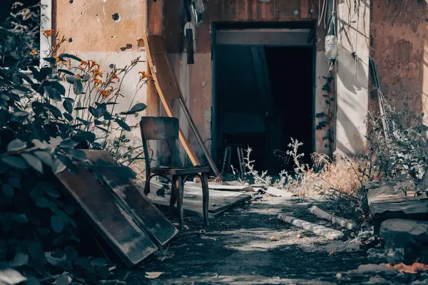 old broken door of a destroyed house war in Ukraine
