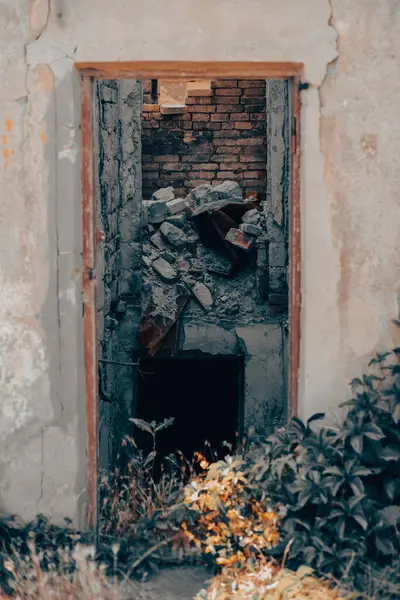 old broken door of a destroyed house war in Ukraine