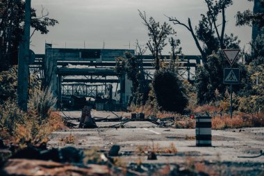 burnt cars and destroyed buildings of the workshop of the Azovstal plant in Mariupol war in Ukraine with Russia