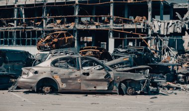 damaged and looted cars in a city in Ukraine during the war with Russia