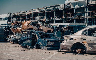 damaged and looted cars in a city in Ukraine during the war with Russia