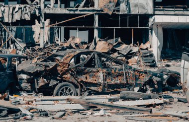 damaged and looted cars in a city in Ukraine during the war with Russia