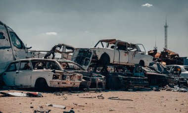damaged and looted cars in a city in Ukraine during the war with Russia clipart