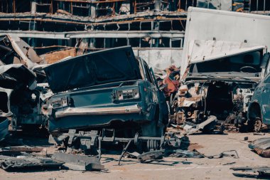 damaged and looted cars in a city in Ukraine during the war with Russia