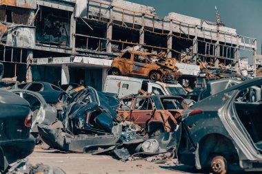 damaged and looted cars in a city in Ukraine during the war with Russia