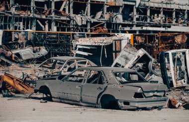 damaged and looted cars in a city in Ukraine during the war with Russia