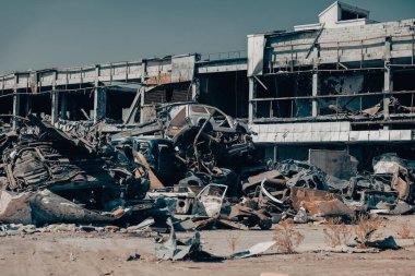 damaged and looted cars in a city in Ukraine during the war with Russia