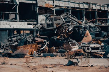 damaged and looted cars in a city in Ukraine during the war with Russia