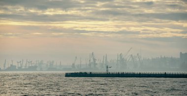 smoke after the explosion in the seaport war in Ukraine with Russia