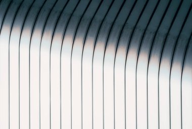 Modern bir binanın gri kıvrımlı duvarı monokrom soyut mimari arka plan deseni