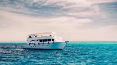 white cruise tourist boat on the background of the coast in the Red Sea in Sharm El Sheikh Egypt