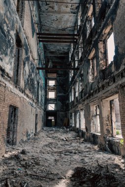 destroyed building in a city lost during the war with Ukraine without people clipart