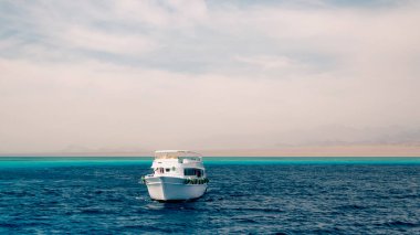 white cruise tourist boat on the background of the coast in the Red Sea in Sharm El Sheikh Egypt
