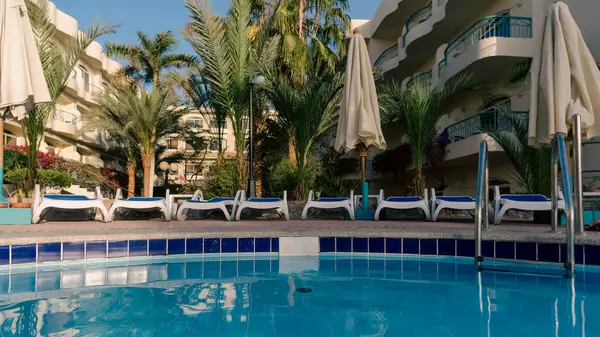 stock image pool without people and palm trees in an empty hotel in Hurghada Egypt