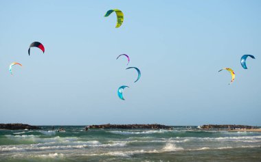 Kitesurfing. Surfers of all ages train in the Mediterranean. Israel, Ashkelon, January 2023 Training continues. Sport, health, recreation concept