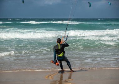 Kitesurfing. Surfers of all ages train in the Mediterranean. Israel, Ashkelon, January 2023 Training continues. Sport, health, recreation concept