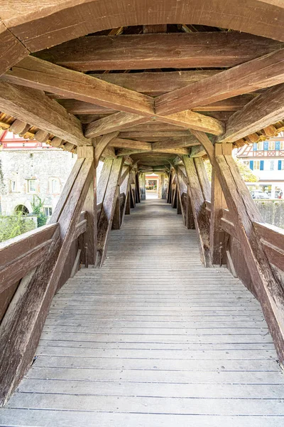 Stock image Old wooden and roofed bridge across the little river