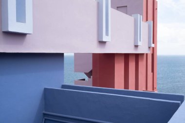 The iconic Muralla Roja building with minimal architecture and the Mediterranean Sea clipart