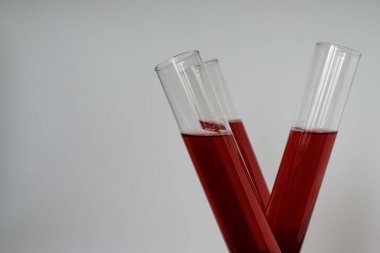 Three beakers of red wine. Copy space. Unexpected concept.