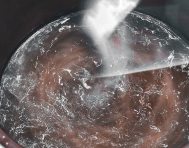 Abstract fluid movement. Brown and white. Blurred image.