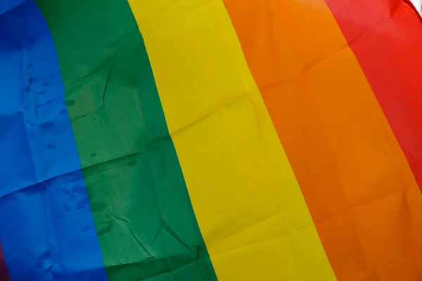 Rainbow flag. Pride flag. Background. Raindrops.